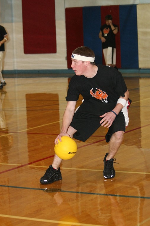 Scott Wilkinson of the Killer K's picks up a ball and looks for a target during the superior High School Business Professionals Association Dodgeball Tournament