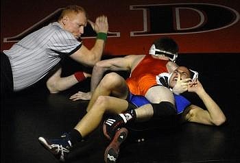 Flathead senior Tanner Beaman pins Missoula Sentinel's Sean King in a 135-pound match at Flathead on Tuesday. Beaman's fall time 1:51. Garrett Cheen/Daily Inter Lake