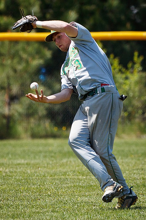 &lt;p&gt;SHAWN GUST/Press Off balance, Eric Cooper attempts to catch the ball with his bare hand after losing it in the sun during the 4A Region 1and 2 baseball tournament Saturday, May 12, 2012 in Rathdrum.&lt;/p&gt;