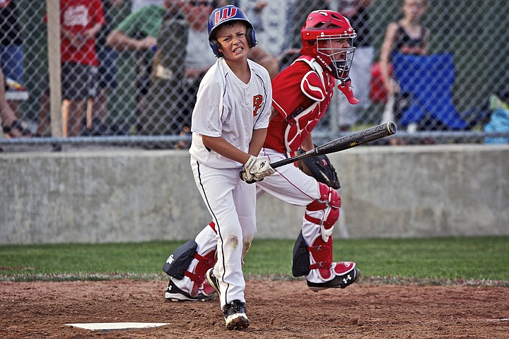 &lt;p&gt;JEROME A. POLLOS/Press Post Falls' Tristan Morrow shows his frustration after striking out as Hayden catcher Hunter Wabs races to the mound to congratulate his pitcher on the finish Friday at Croffoot Park.&lt;/p&gt;