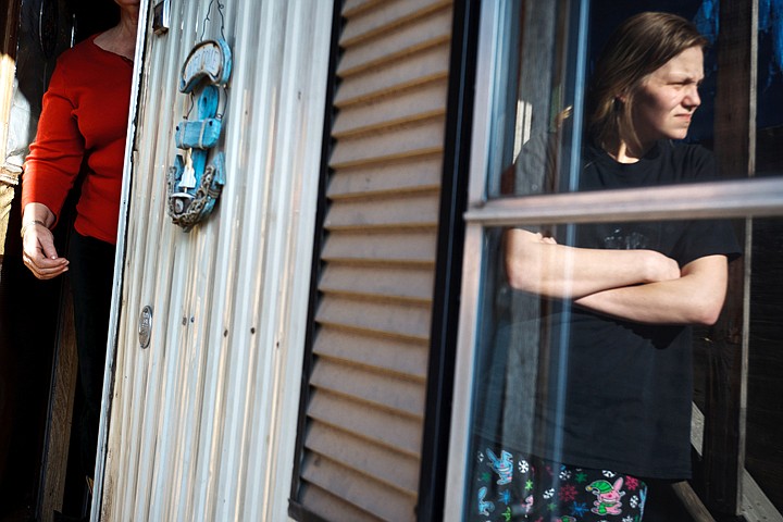 &lt;p&gt;SHAWN GUST/Press 22-year-old Nicole Cornett is reflected in a window Tuesday, January 31, 2012 as a neighbor describes her surprise and frustration after recently receiving an eviction notice at her home in El Rancho Mobile Home Park in Post Falls.&lt;/p&gt;