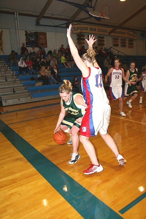 St. Regis Lady Tiger Tyler Cheesman pushed past Superior Lady Bobcats.