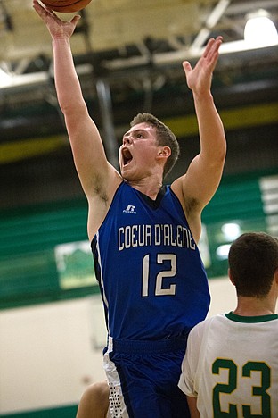 <p>Coeur dAlene junior Colby Daniels breaks through Lakelands defense, scoring a basket Tuesday.</p>