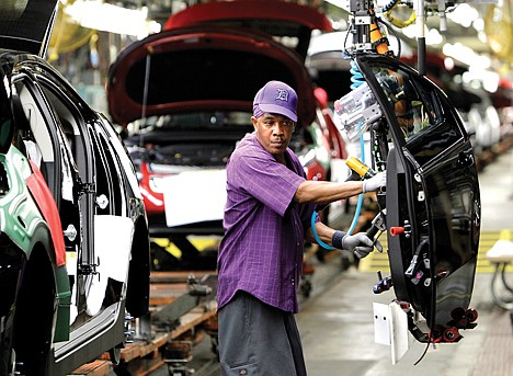 &lt;p&gt;Assembly line worker Edward Houie moves a door into position for a 2012 Chevrolet Volt at the General Motors Hamtramck Assembly plant in Hamtramck, Mich., in July 2011. The U.S. economy grew at a 2.8 percent annual rate in the final three months of last year, the fastest growth in 2011, according to the Commerce Department.&lt;/p&gt;