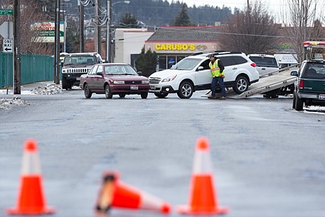 &lt;p&gt;GABE GREEN/Press Locust Avenue was temporarily closed and Third Street traffic was impeded when two vehicles collided where the two roads intersect Friday afternoon in Coeur d&#146;Alene.&lt;/p&gt;