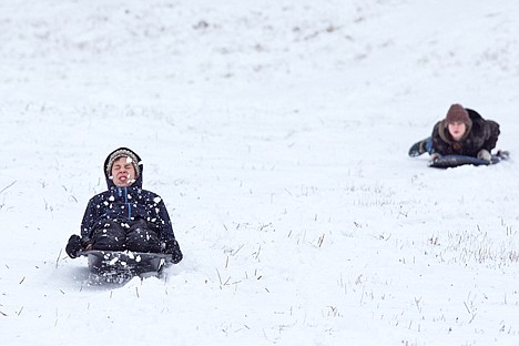 &lt;p&gt;Manasseh Klemm, 14, grimaces as he rides over uneven snow on Cherry Hill Wednesday after (insert figure) inches of snow fell on Coeur d&#146;Alene Tuesday night.&lt;/p&gt;