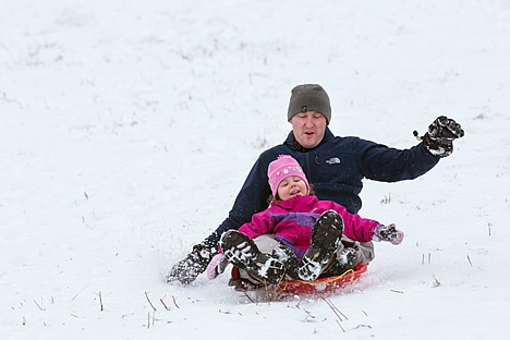 &lt;p&gt;GABE GREEN/Press Gabby DeSomma, 3, sleds down Cherry Hill with her dad Josh before school Wednesday.&lt;/p&gt;