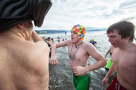 &lt;p&gt;Aaron Stribling bounds from Lake Coeur d&#146;Alene Wednesday morning at the 2014 Polar Bear Plunge at Sanders Beach.&lt;/p&gt;