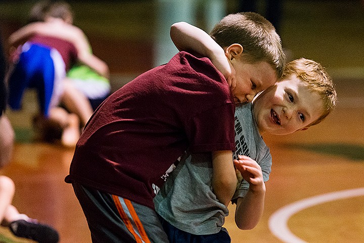 &lt;p&gt;SHAWN GUST/Press Isaac Carlson, 6, right, laughs while being taken down by Gryer Hollibaugh, 5, during the tournament of a youth wrestling camp Thursday at North Idaho College. The three-week-long camp, co-hosted by NIC and the City of Coeur d&#146;Alene Recreation Department, consisted of six practices in basic technique for children kindergarten through sixth grade and finished with Thursday&#146;s tournament.&lt;/p&gt;