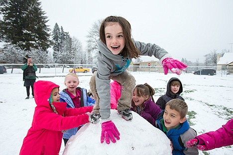 &lt;p&gt;GABE GREEN/Press Sorensen second-grader Sam Beamis, 8, balances atop a large snowball during recess Wednesday afternoon. Principal Janet Ackerman later announced that this behavior is not allowed due to safety concerns.&lt;/p&gt;