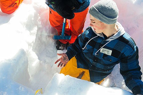 &lt;p&gt;Ty Moulton, a sophomore at Post Falls High, waits a moment for a temperature reading of a section of snowpack.&lt;/p&gt;