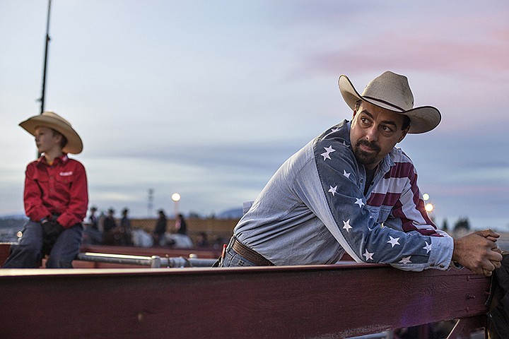 &lt;p&gt;GABE GREEN/Press Kris Ratzlaff, a volunteer for the Pro-West Rodeo Finals, and his son Jacob, left, look on at saddle bronc riders as the sun goes down on the Kootenai County Fairgrounds Saturday October, 5.&lt;/p&gt;