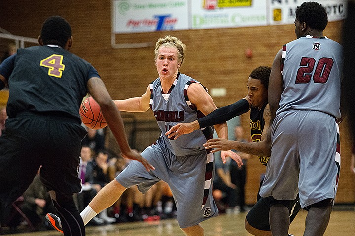 &lt;p&gt;GABE GREEN/Press NIC Freshman Cole Kesler bounds through Arizona Western players on his way to the hoop Saturday November, 16.&lt;/p&gt;