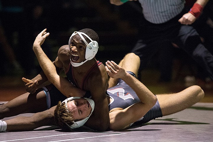 &lt;p&gt;GABE GREEN/Press NIC freshman 141 pound Terrance McKinney pins Northwest&#146;s Zac Loveless one handed in the final seconds of their fourth round on Friday December, 13.&lt;/p&gt;