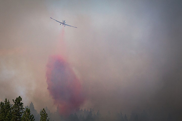 &lt;p&gt;SHAWN GUST/Press A firefighting aircraft dumps retardant on a fire near Mica Bay estimated to be five acres in size near Doubletree Road on Tuesday, July 30, 2013.&lt;/p&gt;