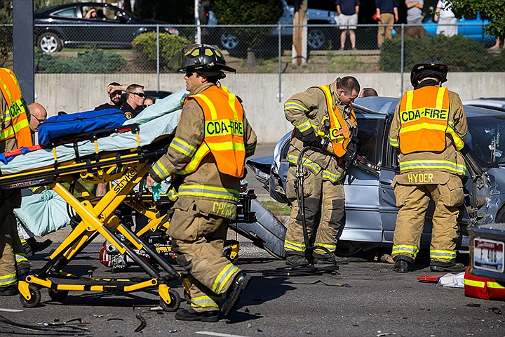 &lt;p&gt;GABE GREEN/Press Coeur d'Alene firefighters cut the door off of a car involved in a fatal three car collision at the intersection of Northwest Boulevard and River Avenue Tuesday August, 27.&lt;/p&gt;