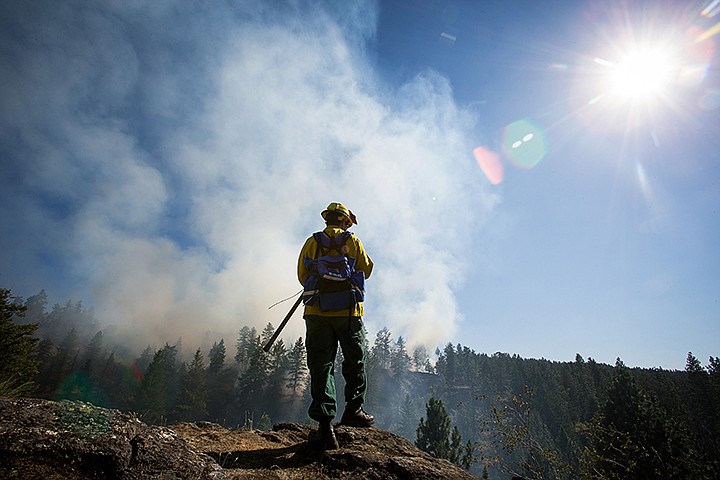 &lt;p&gt;SHAWN GUST/Press James Neils, chief 702 with Hauser Lake Fire Protection District, holds a post as the northeast safety lookout over Lower Fifth Canyon in Q'emiln Park Monday, July 22, 2013 during a wildland fire.&lt;/p&gt;