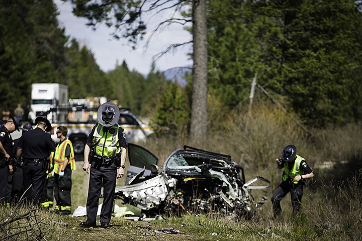 &lt;p&gt;SHAWN GUST/Press A trooper with Idaho State Police pauses while processing the scene of a fatal collision Thursday, April 25, 2013 on Highway 41 near Twin Lakes.&lt;/p&gt;