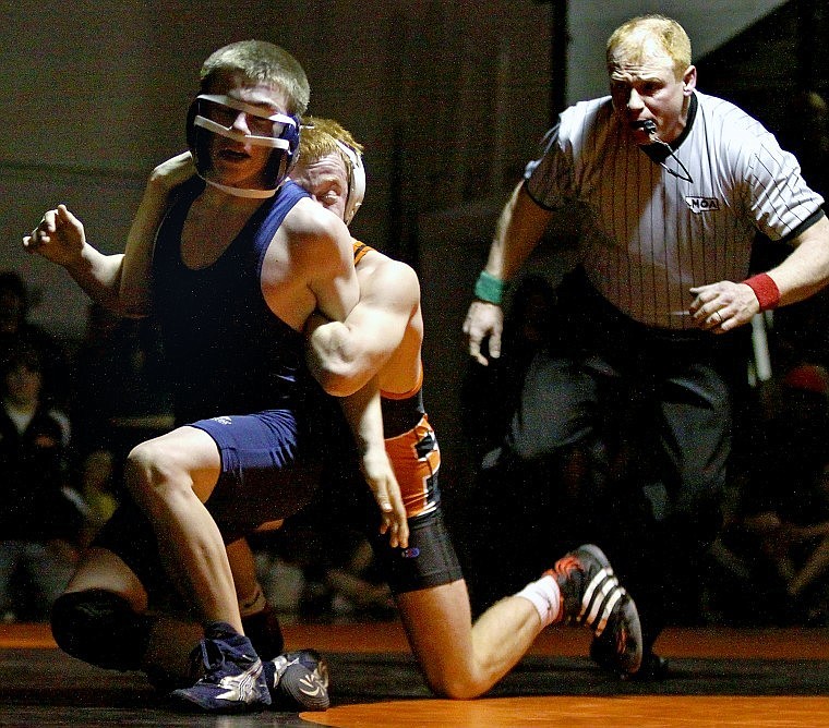 Flathead&#146;s Caleb Piasecki keeps Glacier&#146;s Lucas Mantel arms tied in a 119-pound match during Thursday evening&#146;s crosstown dual at Flathead.