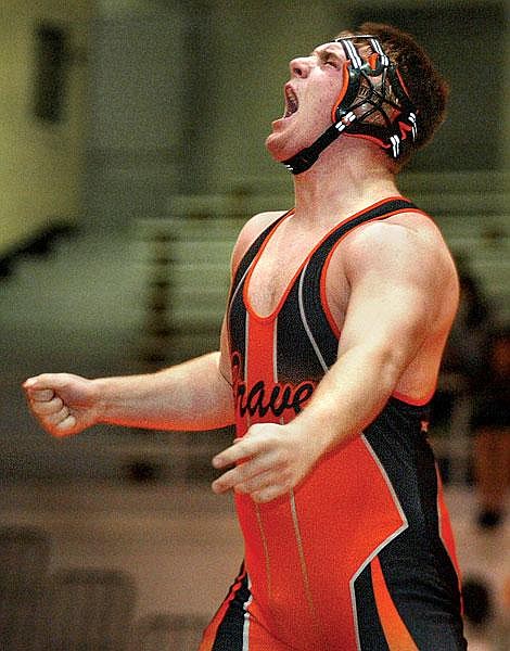 Flathead&#146;s Dan Ogden celebrates after pinning Helena Capital&#146;s Jeff Mahana in the &lt;br&gt;275-pound weight class Saturday at Flathead High. With the win, Ogden improved his record to 19-1 on the season. Craig Moore/Daily Inter Lake Braves double up