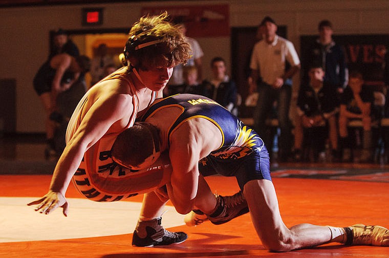 &lt;p&gt;Flathead 152-pound wrestler Cameron Mantel (left) is taken down by Big Sky's Kade Branson Tuesday night during Flathead's loss to Big Sky. Jan. 28, 2014 in Kalispell, Montana. (Patrick Cote/Daily Inter Lake)&lt;/p&gt;