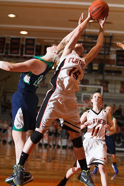 &lt;p&gt;Flathead senior Emily Russell (15) grabs a rebound Tuesday night during the crosstown matchup at Flathead High School. Tuesday, Jan. 29, 2013 in Kalispell, Montana. (Patrick Cote/Daily Inter Lake)&lt;/p&gt;