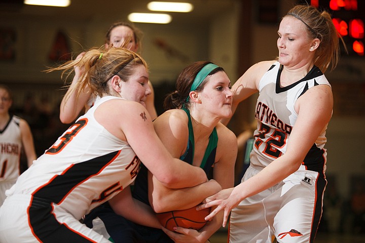 &lt;p&gt;Flathead junior Jenessa Heine (43) ties up the ball held by Glacier junior center Cassidy Hashley (21) Tuesday night during the crosstown matchup at Flathead High School. Tuesday, Jan. 29, 2013 in Kalispell, Montana. (Patrick Cote/Daily Inter Lake)&lt;/p&gt;