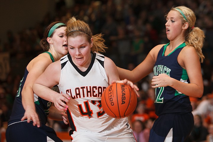 &lt;p&gt;Flathead junior Jenessa Heine (43) drives past Glacier junior center Cassidy Hashley (21) and Glacier junior forward Hannah Atlee (12) Tuesday night during the crosstown matchup at Flathead High School. Tuesday, Jan. 29, 2013 in Kalispell, Montana. (Patrick Cote/Daily Inter Lake)]&lt;/p&gt;