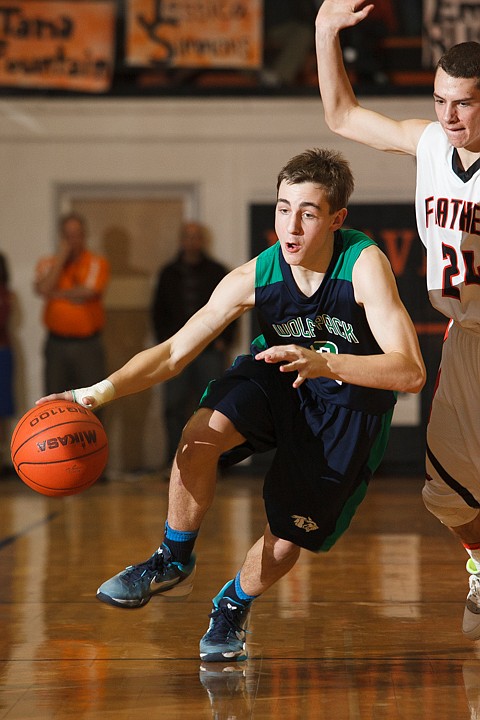 &lt;p&gt;Glacier senior guard Charlie Obermiller (2) brings the ball up court Tuesday night during the crosstown matchup at Flathead High School. Tuesday, Jan. 29, 2013 in Kalispell, Montana. (Patrick Cote/Daily Inter Lake)&lt;/p&gt;