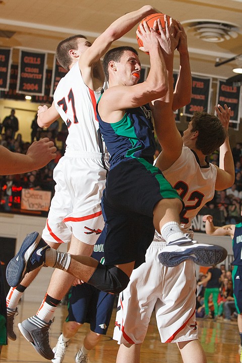 &lt;p&gt;Glacier senior guard Kyle Griffith (4) is fouled by Flathead senior Kaleb Cannaday (21) and Flathead junior Will Cronk (22) Tuesday night during the crosstown matchup at Flathead High School. Tuesday, Jan. 29, 2013 in Kalispell, Montana. (Patrick Cote/Daily Inter Lake)&lt;/p&gt;