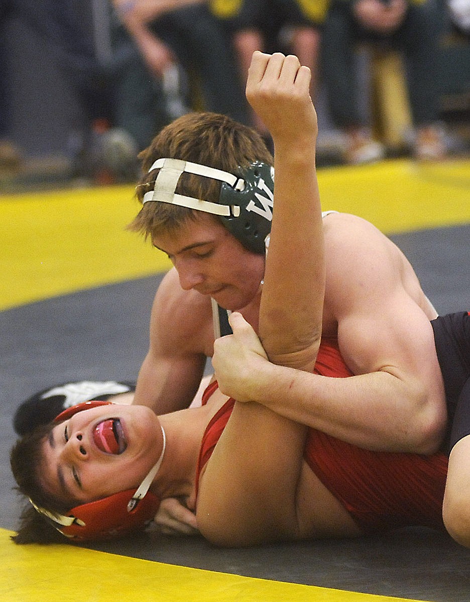 <p>Whitefish 152-pound wrestler Matt Sampson pins Brownings Ryan Long Time Sleeping during the Whitefish Duals on Friday. (Aaric Bryan/Daily Inter Lake)</p>