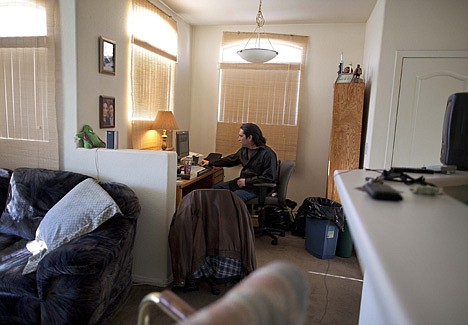 &lt;p&gt;Unemployed bartender Bud Meyers sits at his computer where he spends most of his time blogging in his apartment in Las Vegas.&lt;/p&gt;