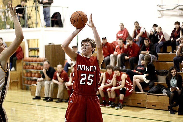 &lt;p&gt;Junior Red Devil Tanner Tammaro gets ready to shoot the ball during the game against St. Regis.&lt;/p&gt;