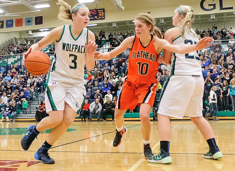 &lt;p&gt;Glacier sophomore guard Katie Thomas (23) sets a screen on Flathead senior Emma Andrews (10) as Glacier sophomore forward Taylor Salonen (3) drives Thursday night during the second half of Glacier's crosstown victory over Flathead at Glacier High School. Jan. 30, 2014 in Kalispell, Montana. (Patrick Cote/Daily Inter Lake)&lt;/p&gt;