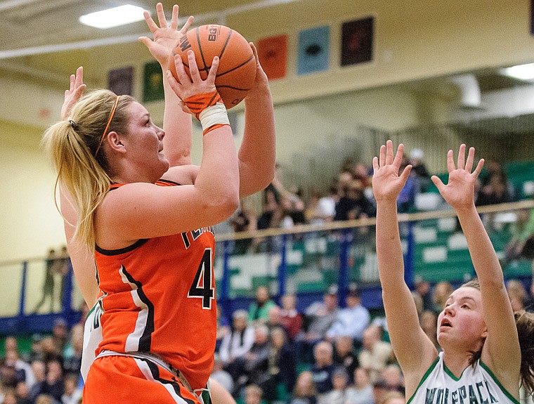 &lt;p&gt;Flathead senior Jenessa Heine (43) puts up a shot Thursday night during the crosstown basketball matchup at Glacier High School. Jan. 30, 2014 in Kalispell, Montana. (Patrick Cote/Daily Inter Lake)&lt;/p&gt;