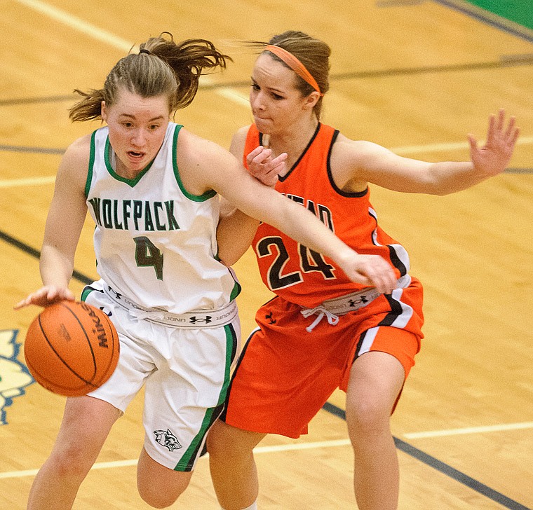 &lt;p&gt;Glacier sophomore guard Hailee Bennett (4) drives past Flathead freshman Kelsey Noland-Gollespie (24) Thursday night during the second half of Glacier's crosstown victory over Flathead at Glacier High School. Jan. 30, 2014 in Kalispell, Montana. (Patrick Cote/Daily Inter Lake)&lt;/p&gt;