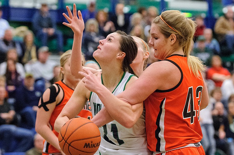 &lt;p&gt;Flathead senior Jenessa Heine (43) fouls Glacier senior center Cassi Hashley (21) Thursday night during the crosstown basketball matchup at Glacier High School. Jan. 30, 2014 in Kalispell, Montana. (Patrick Cote/Daily Inter Lake)&lt;/p&gt;