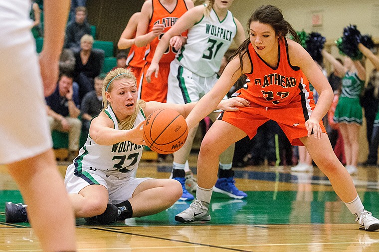 &lt;p&gt;Glacier junior forward Tessa Krueger (left) and Flathead sophomore Lizzie Sherwood fight for a loose ball Thursday night during the second half of Glacier's crosstown victory over Flathead at Glacier High School. Jan. 30, 2014 in Kalispell, Montana. (Patrick Cote/Daily Inter Lake)&lt;/p&gt;