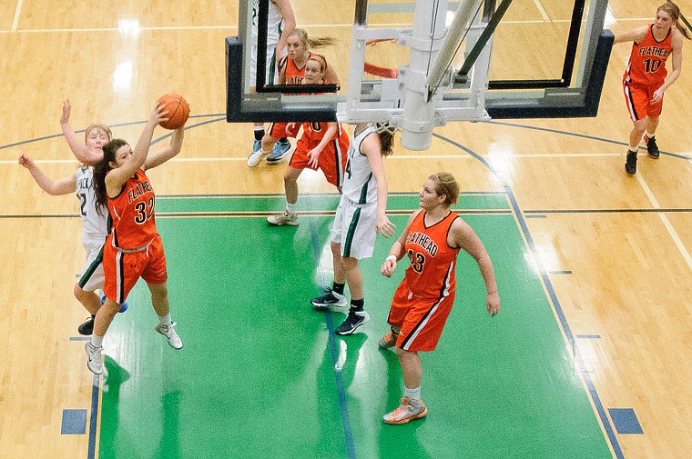 &lt;p&gt;Flathead sophomore Lizzie Sherwood (32) grabs a rebound Thursday night during the second half of Glacier's crosstown victory over Flathead at Glacier High School. Jan. 30, 2014 in Kalispell, Montana. (Patrick Cote/Daily Inter Lake)&lt;/p&gt;