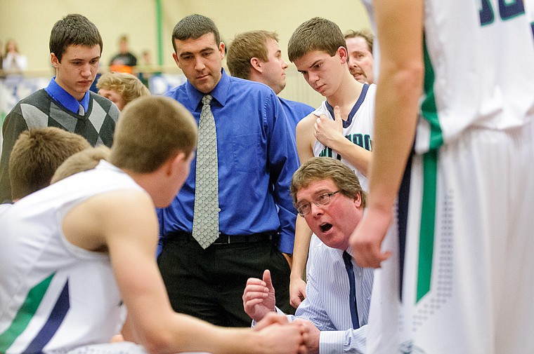 &lt;p&gt;Glacier head coach Mark Harkins talks to his team Thursday night during the second half of Glacier's crosstown victory over Flathead at Glacier High School. Jan. 30, 2014 in Kalispell, Montana. (Patrick Cote/Daily Inter Lake)&lt;/p&gt;