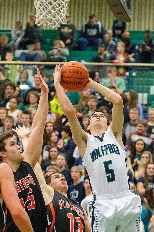 &lt;p&gt;Glacier senior guard Greg Jones (5) puts up a shot Thursday night during the second half of Glacier's crosstown victory over Flathead at Glacier High School. Jan. 30, 2014 in Kalispell, Montana. (Patrick Cote/Daily Inter Lake)&lt;/p&gt;