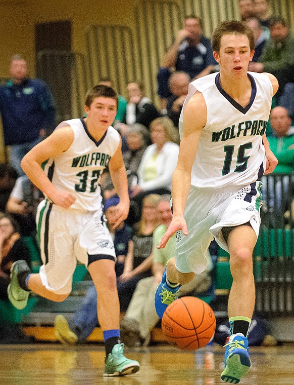 &lt;p&gt;Glacier junior wing Cain Boschee (15) brings the ball up the court Thursday night during the second half of Glacier's crosstown victory over Flathead at Glacier High School. Jan. 30, 2014 in Kalispell, Montana. (Patrick Cote/Daily Inter Lake)&lt;/p&gt;