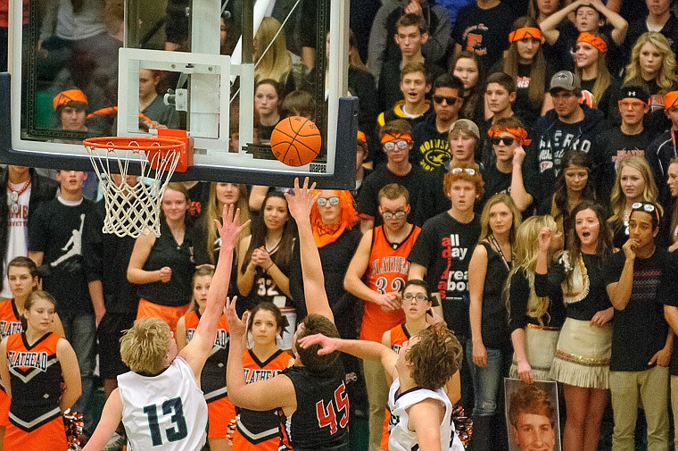 &lt;p&gt;Flathead senior Adam Bradley (45) puts up a shot Thursday night during the second half of Glacier's crosstown victory over Flathead at Glacier High School. Jan. 30, 2014 in Kalispell, Montana. (Patrick Cote/Daily Inter Lake)&lt;/p&gt;