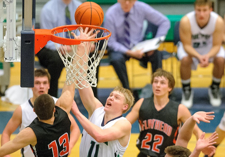 &lt;p&gt;Glacier senior wing Bryan Michaels (11) shoots over Flathead senior Blaine Newman (13) Thursday night during the second half of Glacier's crosstown victory over Flathead at Glacier High School. Jan. 30, 2014 in Kalispell, Montana. (Patrick Cote/Daily Inter Lake)&lt;/p&gt;