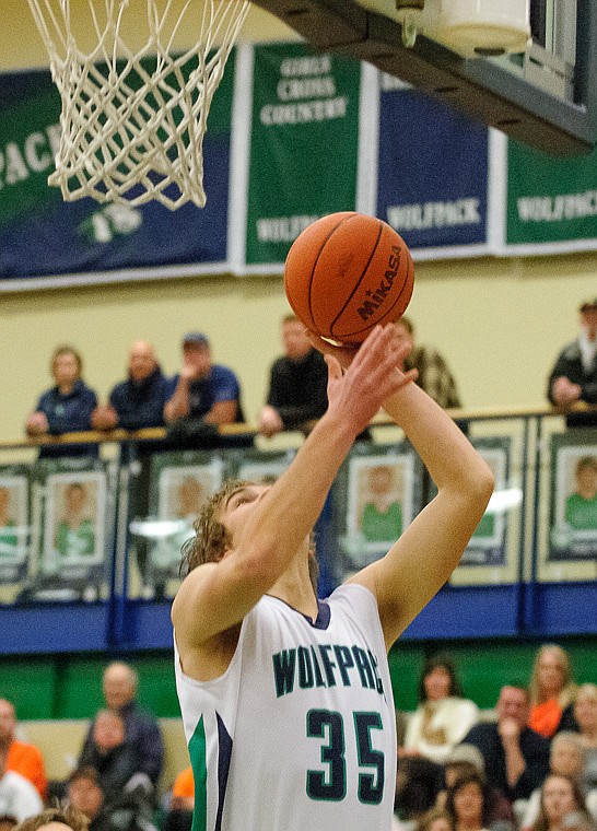 &lt;p&gt;Glacier senior post Kevin Malloy (35) puts up a shot Thursday night during the first half of the crosstown matchup between Glacier and Flathead at Glacier High School. Jan. 30, 2014 in Kalispell, Montana. (Patrick Cote/Daily Inter Lake)&lt;/p&gt;