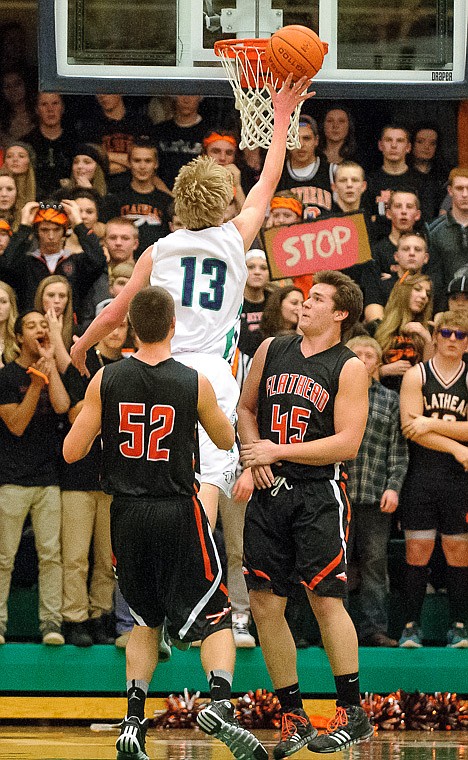 &lt;p&gt;Glacier senior wing Kyler Harkins (13) shoots over defenders Thursday night during the first half of the crosstown matchup between Glacier and Flathead at Glacier High School. Jan. 30, 2014 in Kalispell, Montana. (Patrick Cote/Daily Inter Lake)&lt;/p&gt;