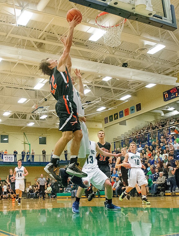 &lt;p&gt;Flathead senior Will Cronk (22) lays the ball up Thursday night during the first half of the crosstown matchup between Glacier and Flathead at Glacier High School. Jan. 30, 2014 in Kalispell, Montana. (Patrick Cote/Daily Inter Lake)&lt;/p&gt;