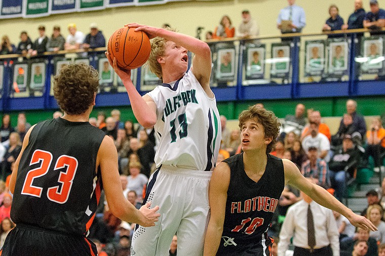 &lt;p&gt;Glacier senior wing Kyler Harkins (13) goes up past Flathead junior Alex Croymans (10) and Flathead senior Chandler Escalante (23) Thursday night during the first half of the crosstown matchup between Glacier and Flathead at Glacier High School. Jan. 30, 2014 in Kalispell, Montana. (Patrick Cote/Daily Inter Lake)&lt;/p&gt;