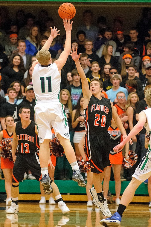 &lt;p&gt;Glacier senior wing Bryan Michaels (11) shoots over Flathead junior Easton Johnson (20) Thursday night during the first half of the crosstown matchup between Glacier and Flathead at Glacier High School. Jan. 30, 2014 in Kalispell, Montana. (Patrick Cote/Daily Inter Lake)&lt;/p&gt;