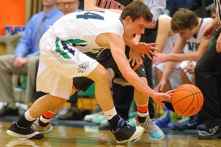 &lt;p&gt;Glacier senior guard Tanner Olsen (14) goes for a loose ball Thursday night during the first half of the crosstown matchup between Glacier and Flathead at Glacier High School. Jan. 30, 2014 in Kalispell, Montana. (Patrick Cote/Daily Inter Lake)&lt;/p&gt;